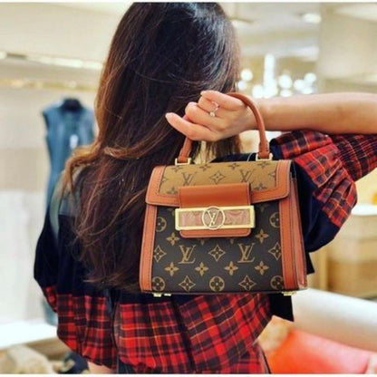 Louis Vuitton Reisse Handbag