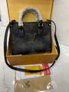 Lv On The Go Monogram Empreinte Bag