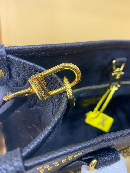 Lv On The Go Monogram Empreinte Bag